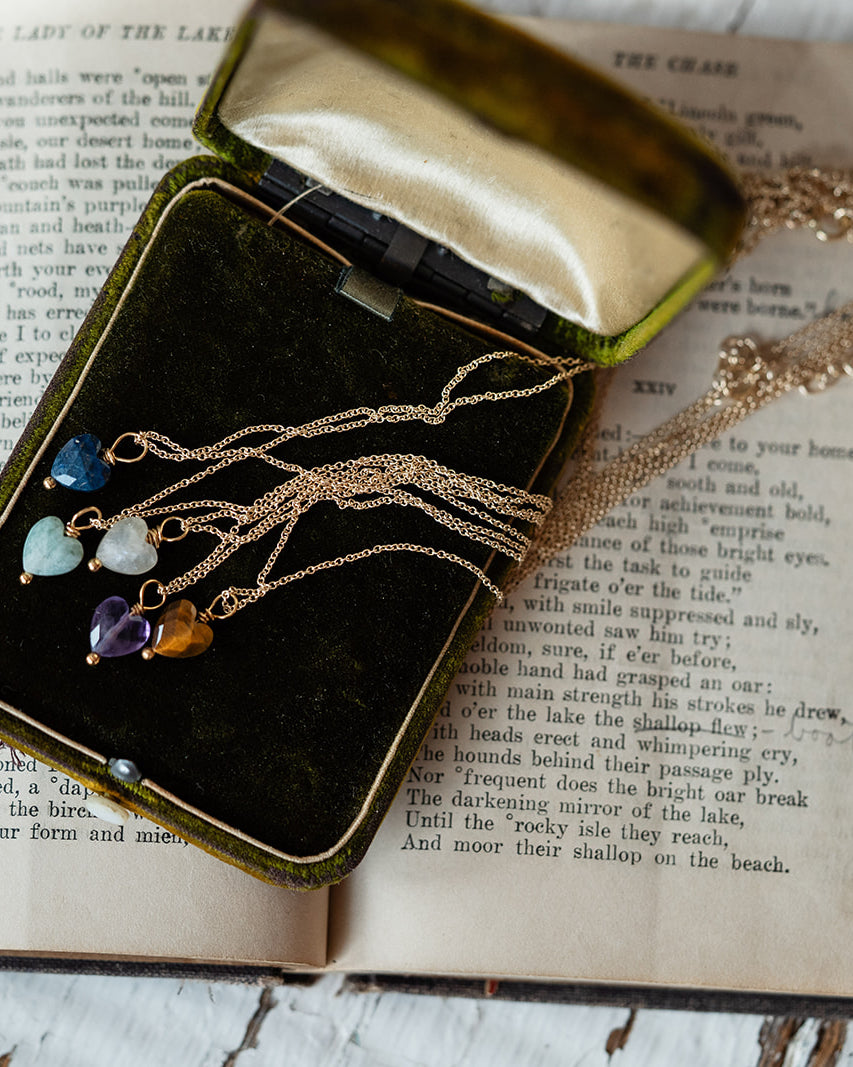 Jewelry box with necklaces on an open book