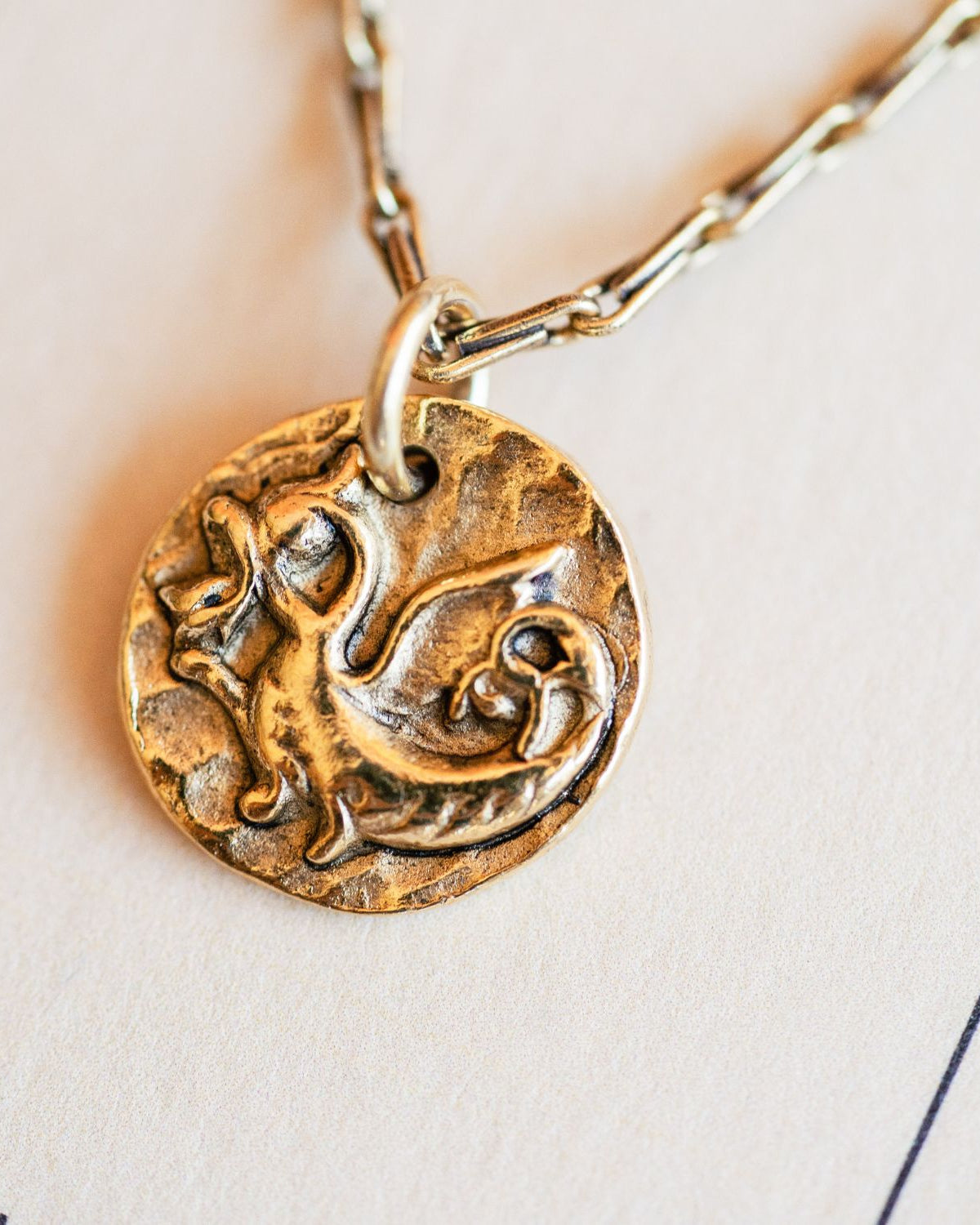Artisan gold dragon pendant necklace featuring vintage mystical button casting by Bella Vita