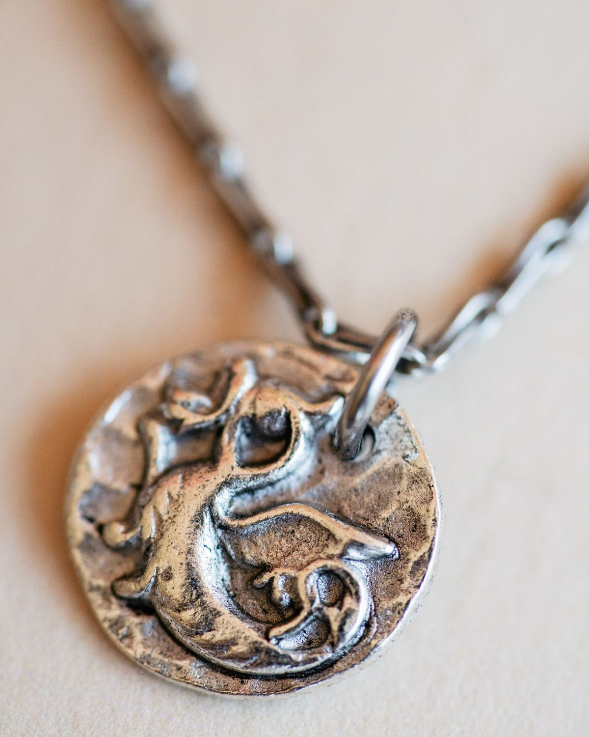 Cast silver dragon pendant from antique button design by Bella Vita Jewelry artisans