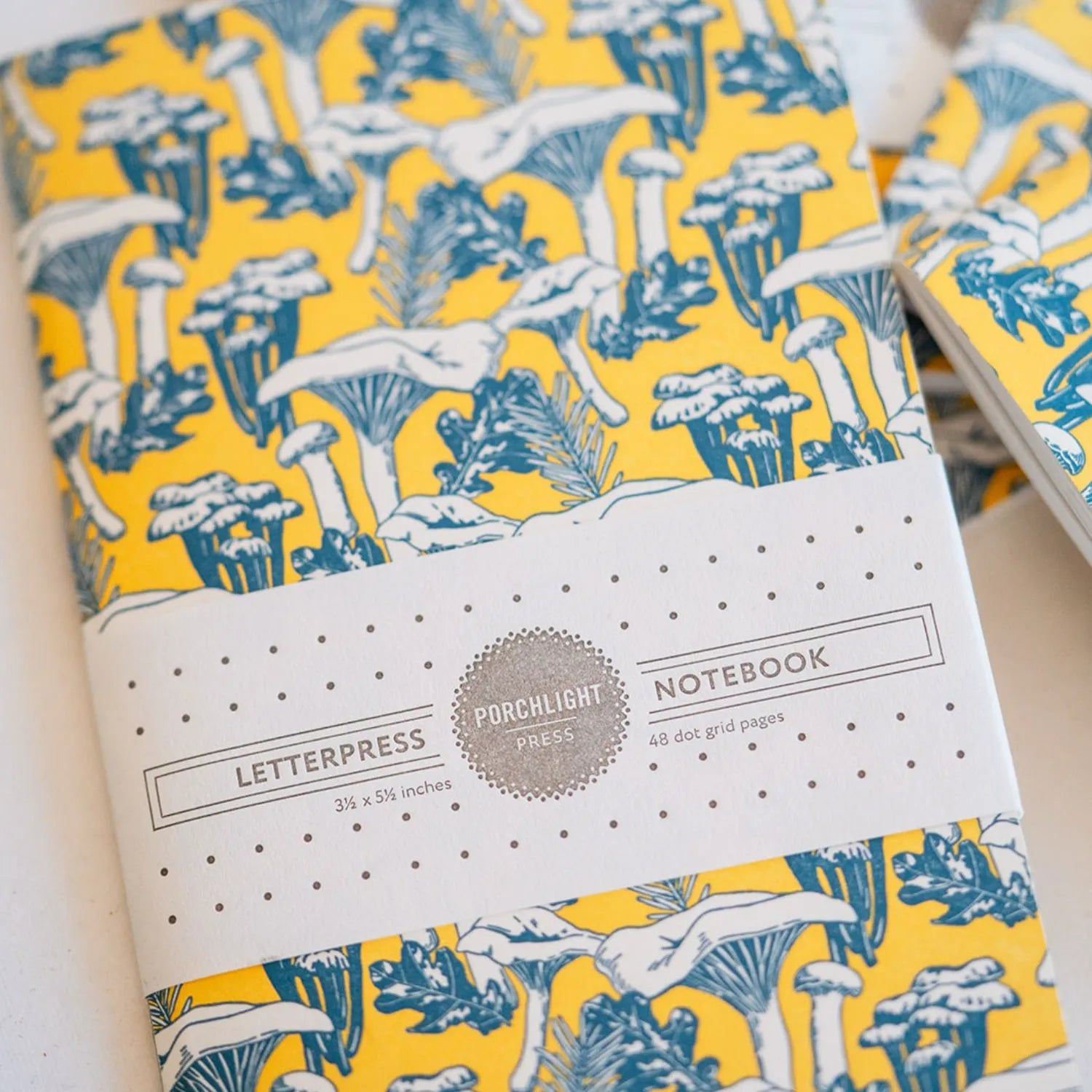 Handmade journal with vibrant yellow floral pattern cover from Bella Vita's stationery collection, featuring artisan-bound pages with a natural paper label - perfect for documenting your beautiful life.