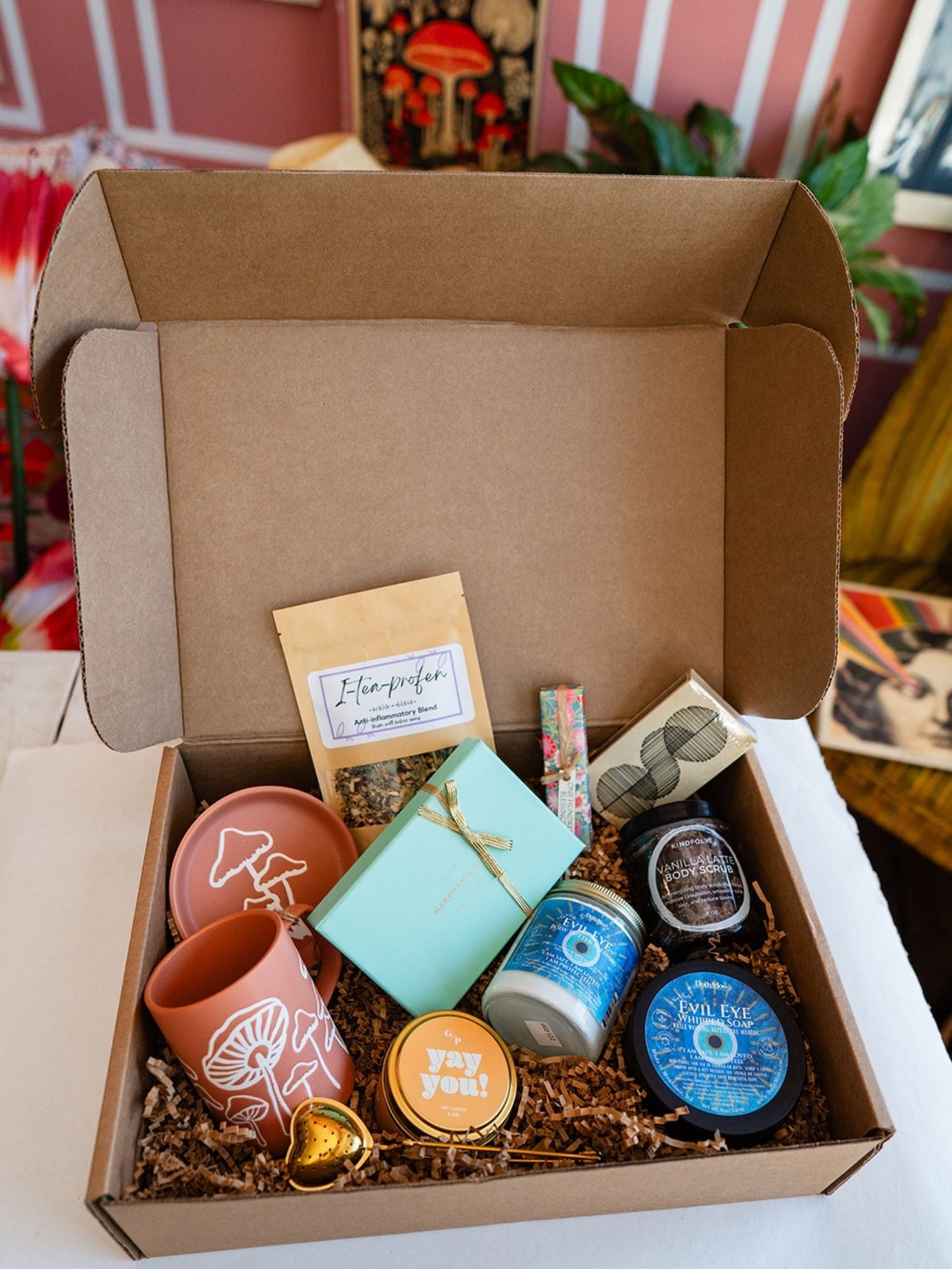 Bella Vita artisan gift box featuring terracotta mushroom mugs, wellness products, healing tea, and a heart-shaped gold tea infuser