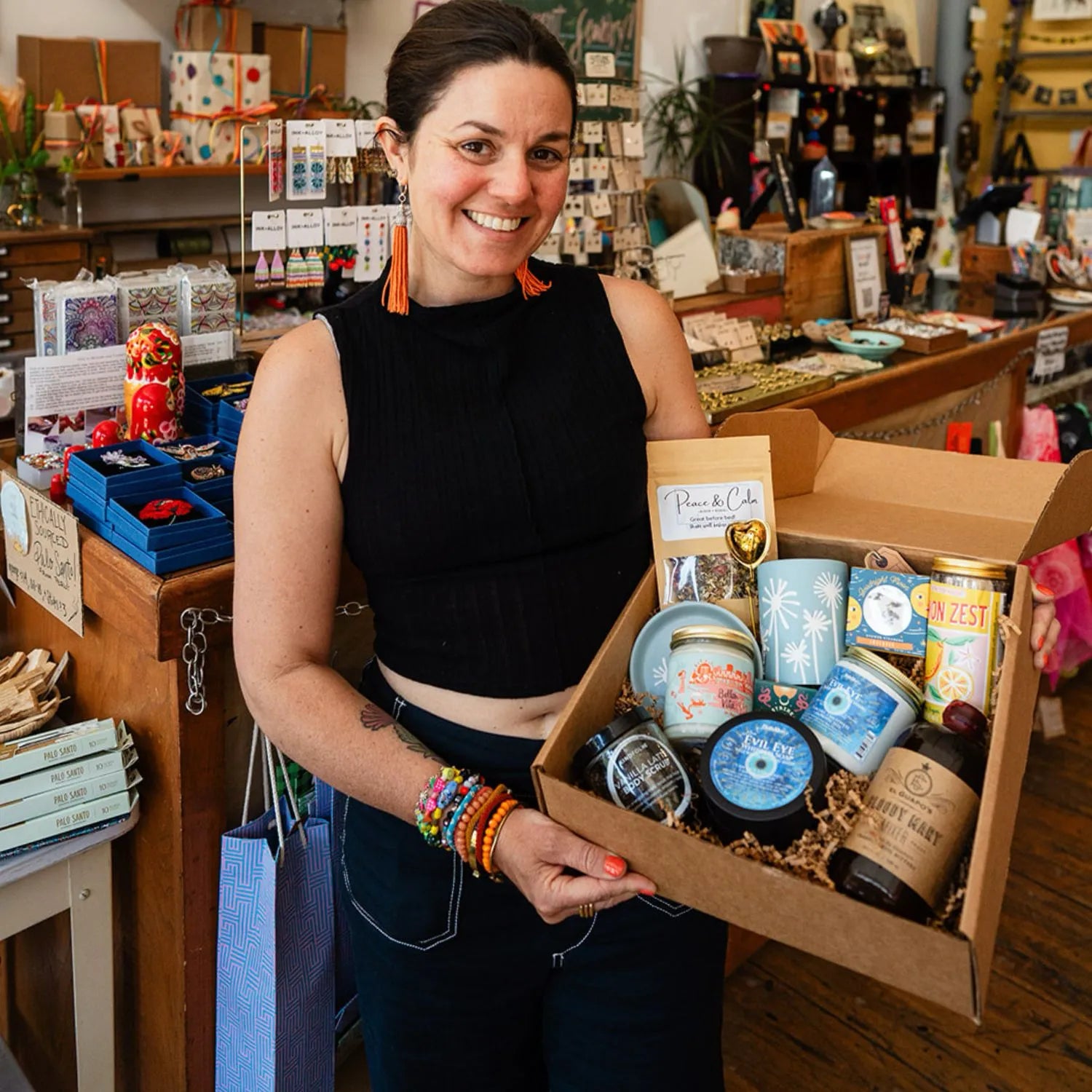 Jewelry artisan Brandy McNair in her Bella Vita Little Rock studio surrounded by handcrafted jewelry collections, showcasing the maker behind each meaningful, handmade piece.