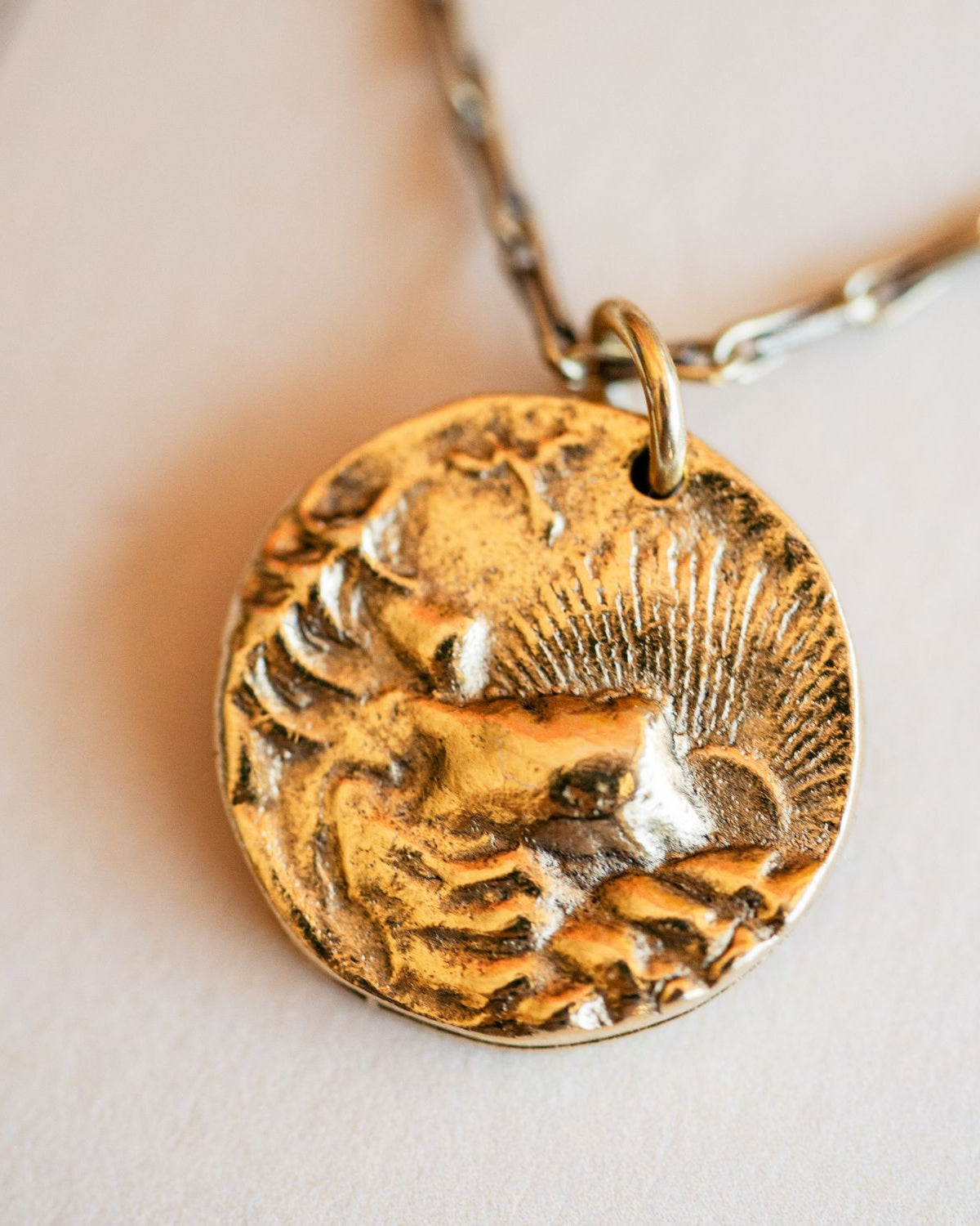 Cast gold mountain sunset pendant from antique button by Bella Vita Jewelry