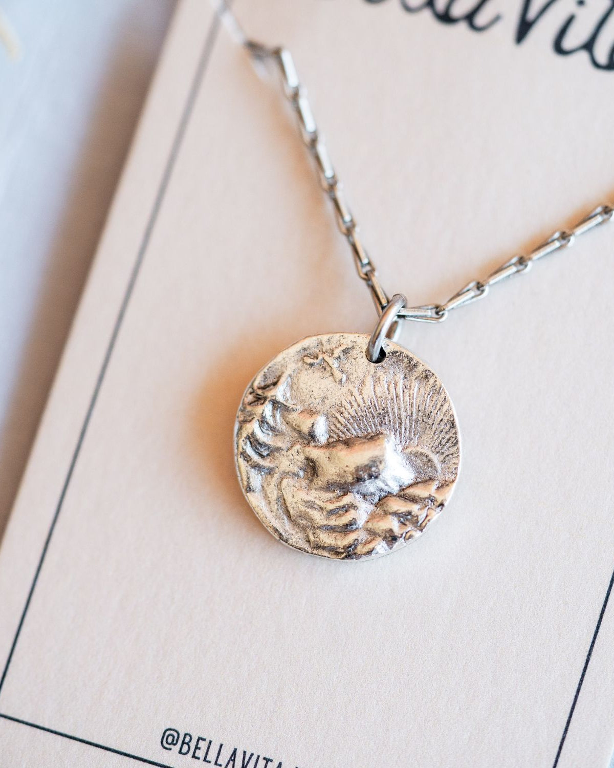 Artisan silver mountain sunset pendant featuring vintage landscape button casting by Bella Vita