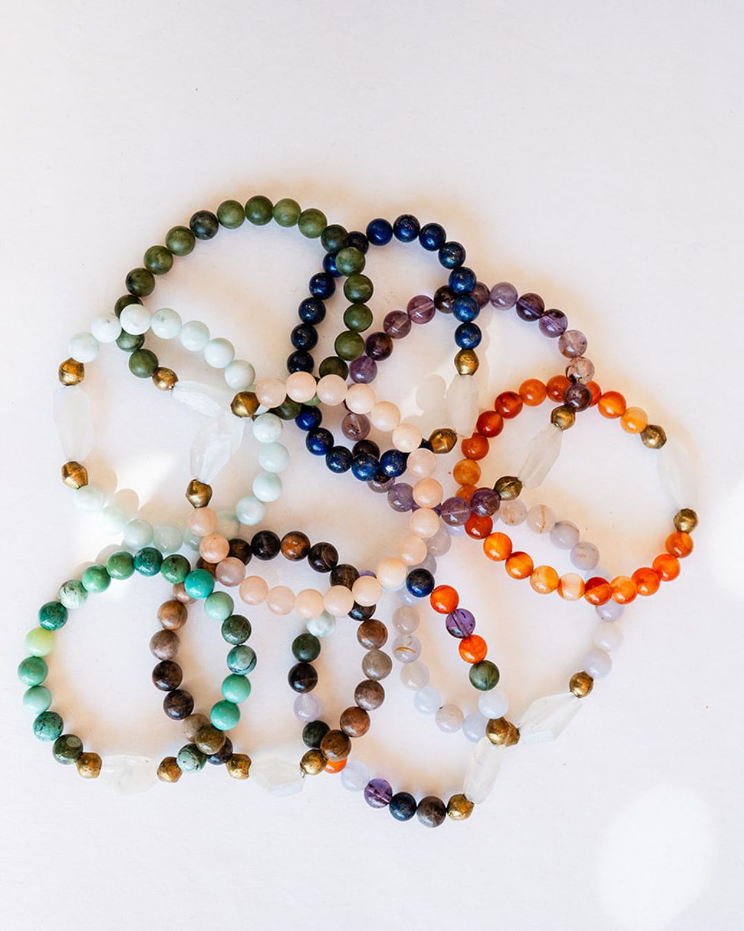 Good Vibes bracelets arranged in circular display