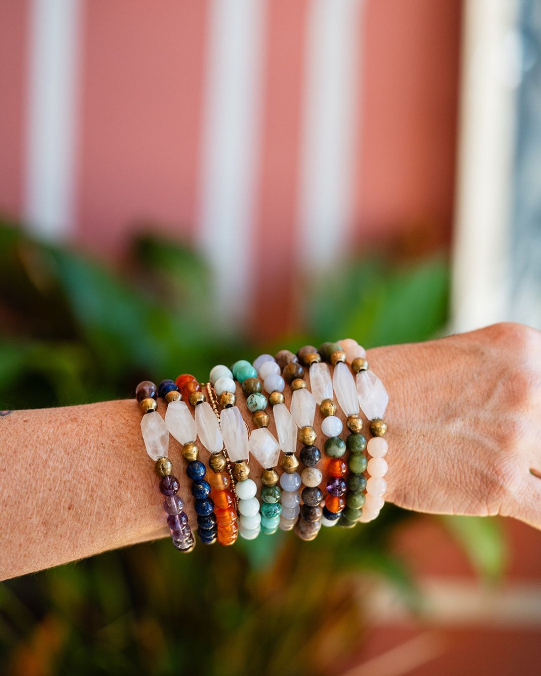 Layered Good Vibes bracelets styled outdoors
