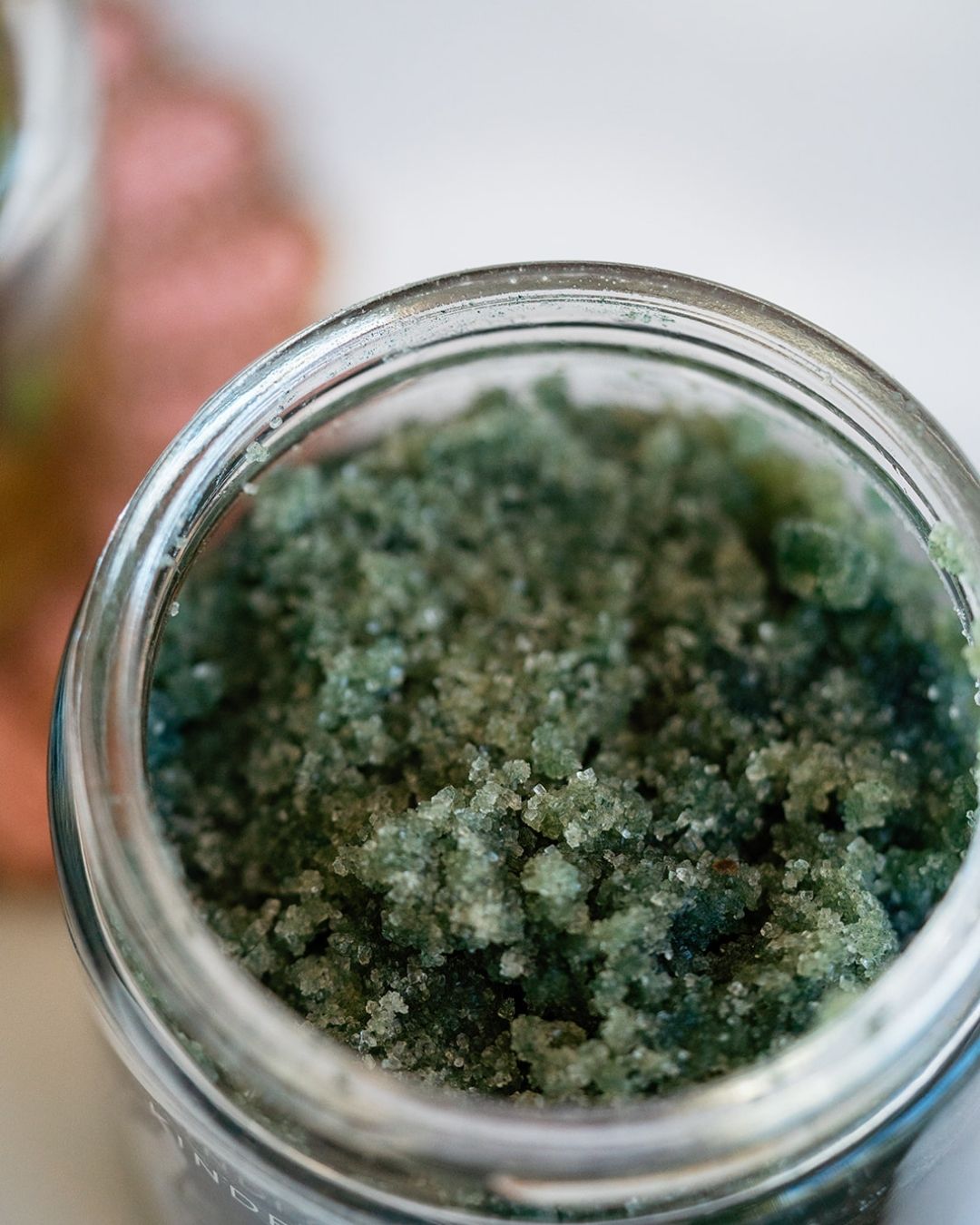 Close-up of green Seven Seas body scrub texture with algae and essential oils