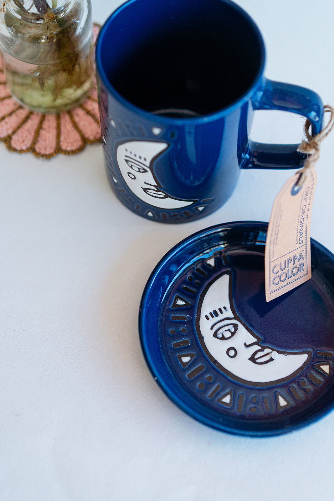 Deep blue Cuppa Color ceramic mug and coaster with white moon and celestial pattern, handcrafted premium drinkware set.