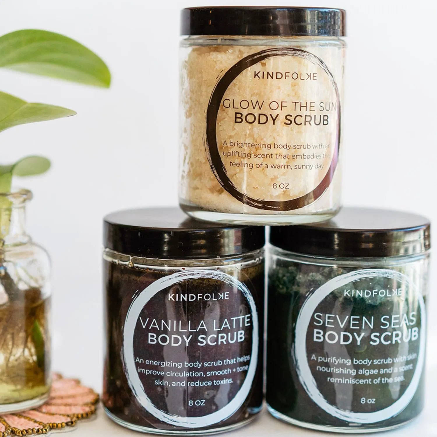 Handcrafted body scrub collection from Bella Vita in glass jars with botanical labels, featuring natural exfoliants made in our Little Rock studio with organic ingredients for self-care rituals.
