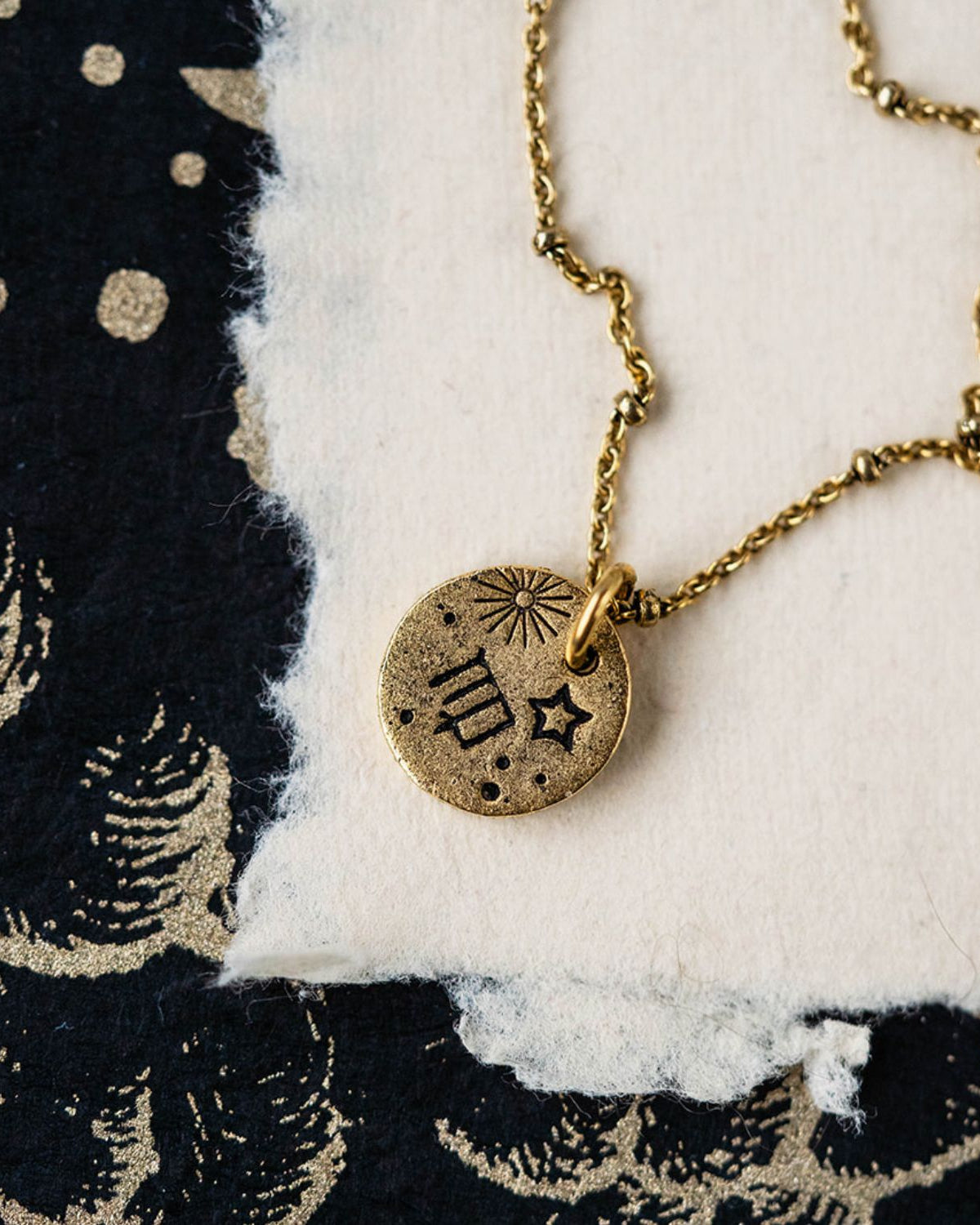 Gold Virgo zodiac pendant necklace with maiden symbols and celestial engravings on chain