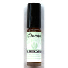 Champa traditional perfume oil by The Incense Sampler in portable glass vial with green label, featuring concentrated Indian fragrance essence.