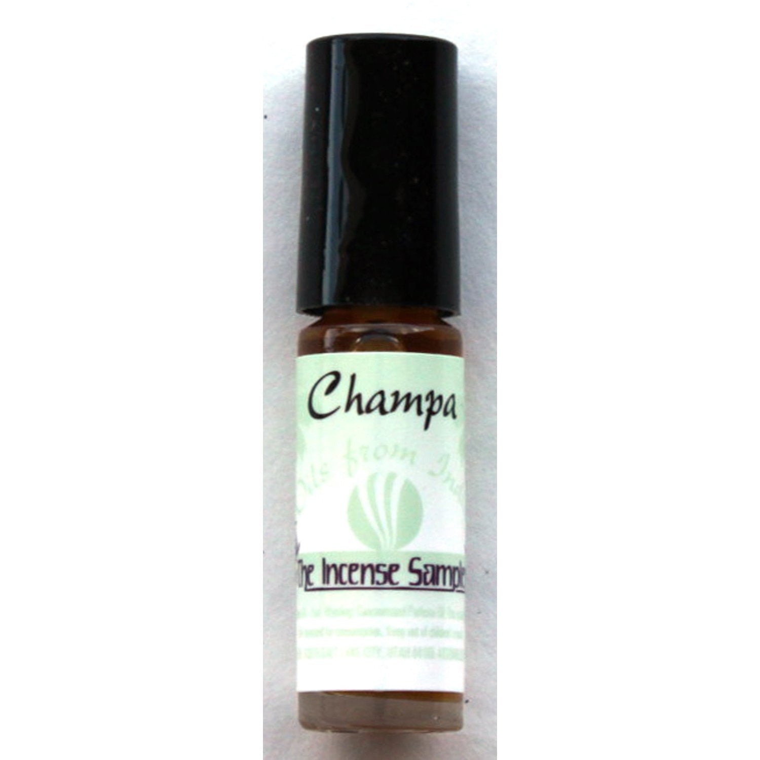 Champa traditional perfume oil by The Incense Sampler in portable glass vial with green label, featuring concentrated Indian fragrance essence.