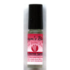 Dragon's Blood concentrated perfume oil from The Incense Sampler in glass roll-on applicator with red label, featuring traditional Indian fragrance.