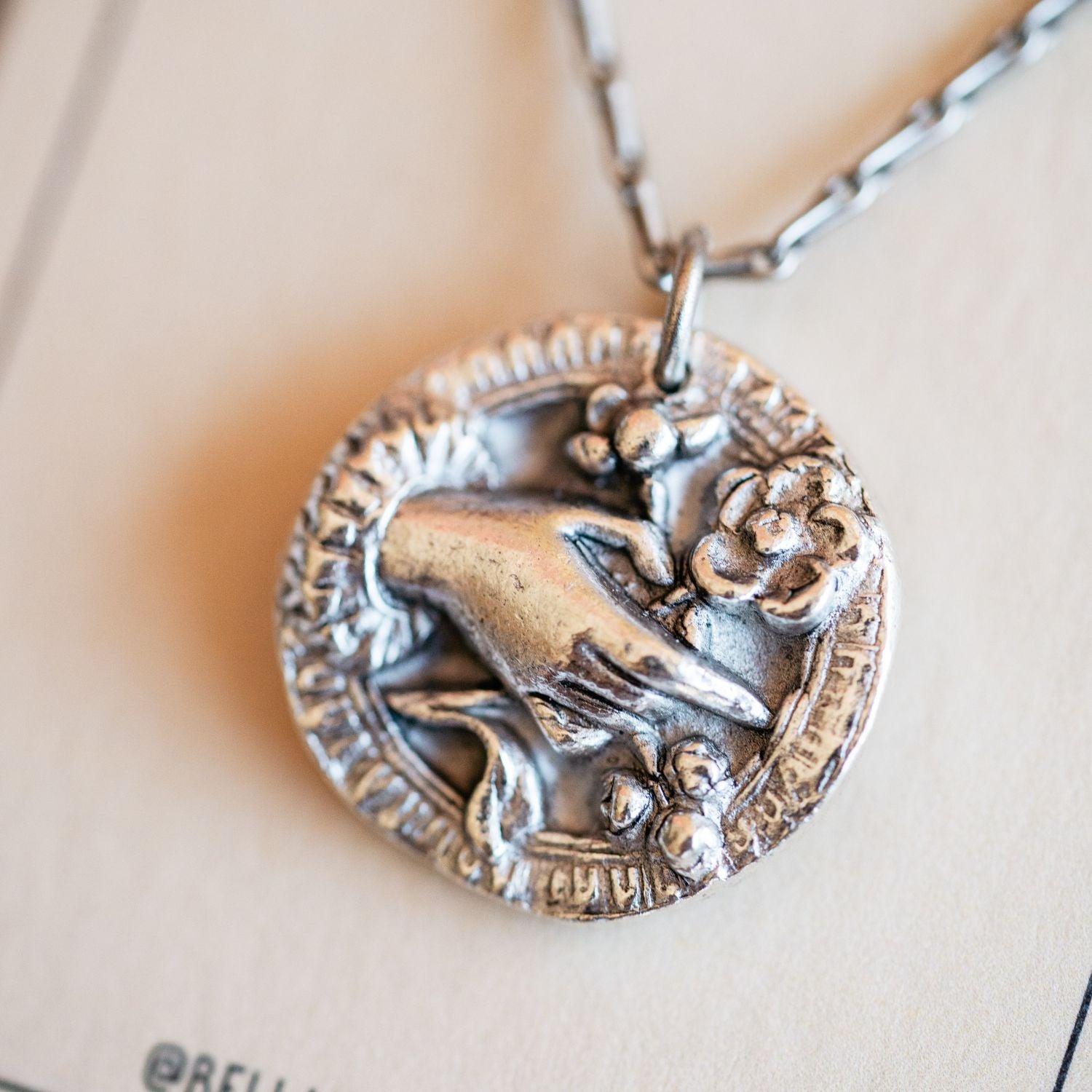 Cast silver bouquet pendant from antique button design by Bella Vita Jewelry artisans