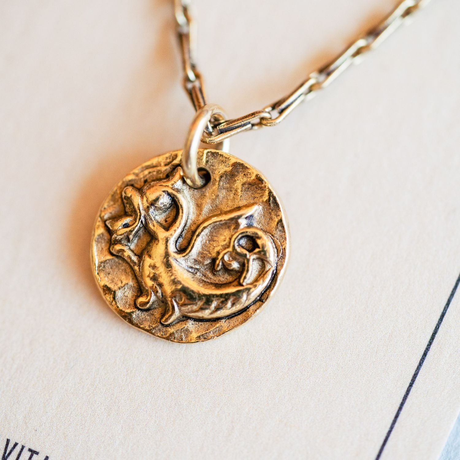 Artisan gold dragon pendant necklace featuring vintage mystical button casting by Bella Vita