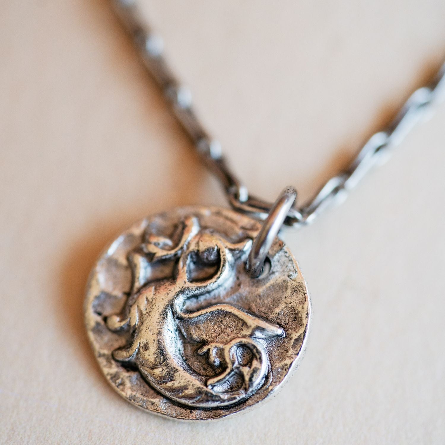Cast silver dragon pendant from antique button design by Bella Vita Jewelry artisans