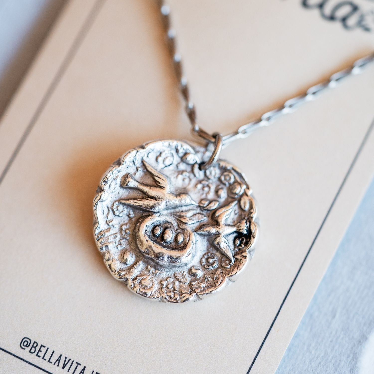 Cast silver mama bird pendant from antique button design by Bella Vita Jewelry