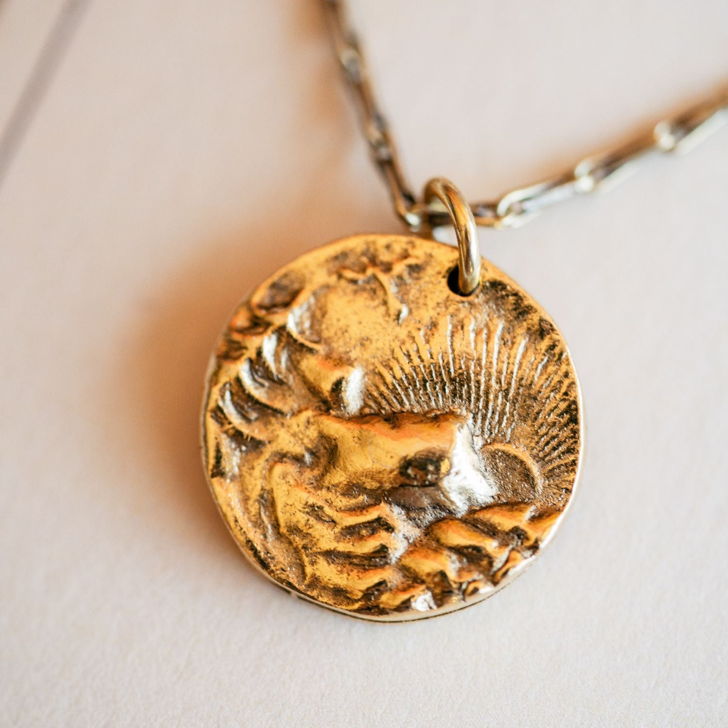 Cast gold mountain sunset pendant from antique button by Bella Vita Jewelry