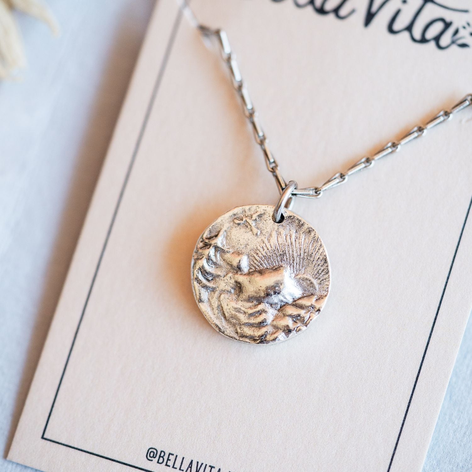 Artisan silver mountain sunset pendant featuring vintage landscape button casting by Bella Vita