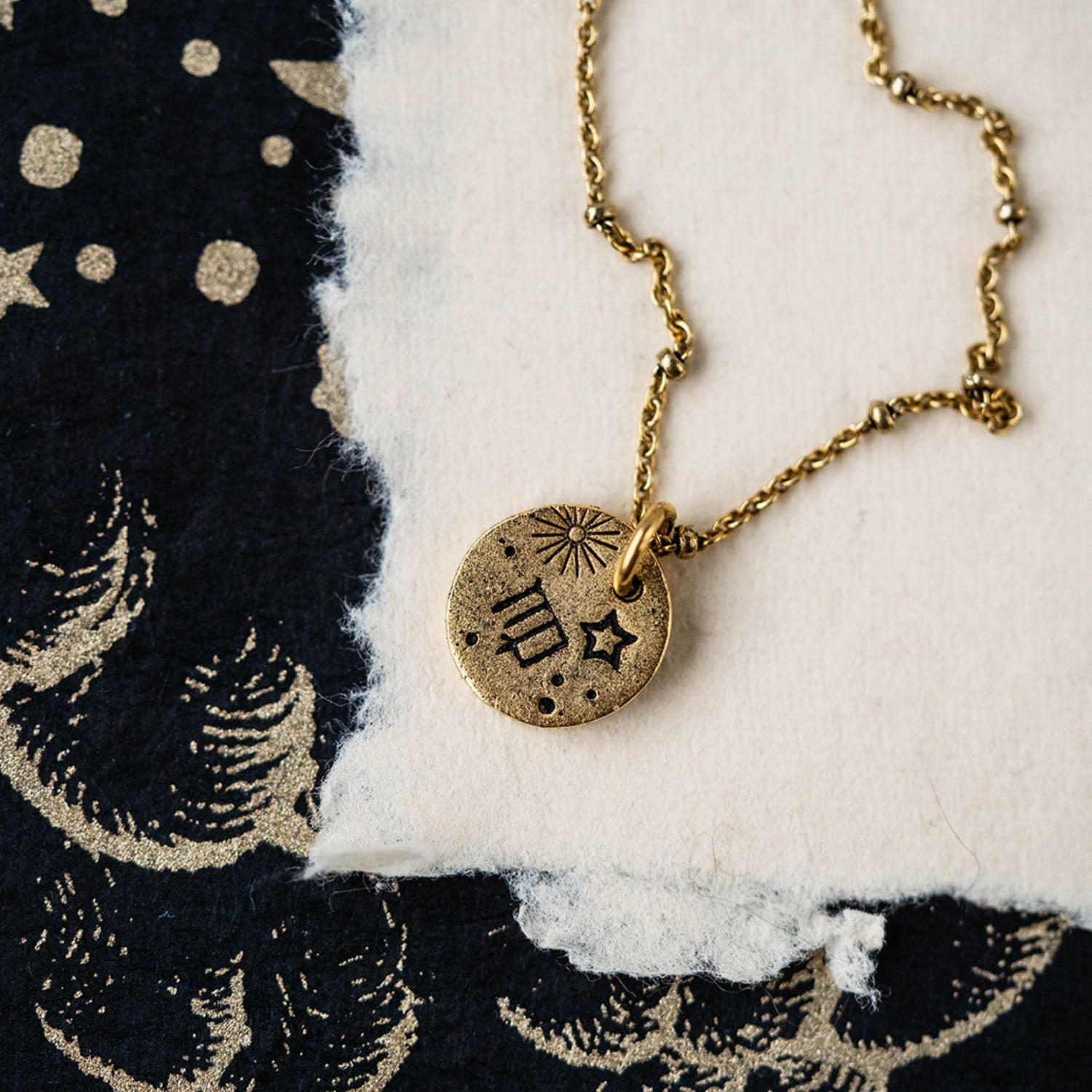 Gold Virgo zodiac pendant necklace with maiden symbols and celestial engravings on chain