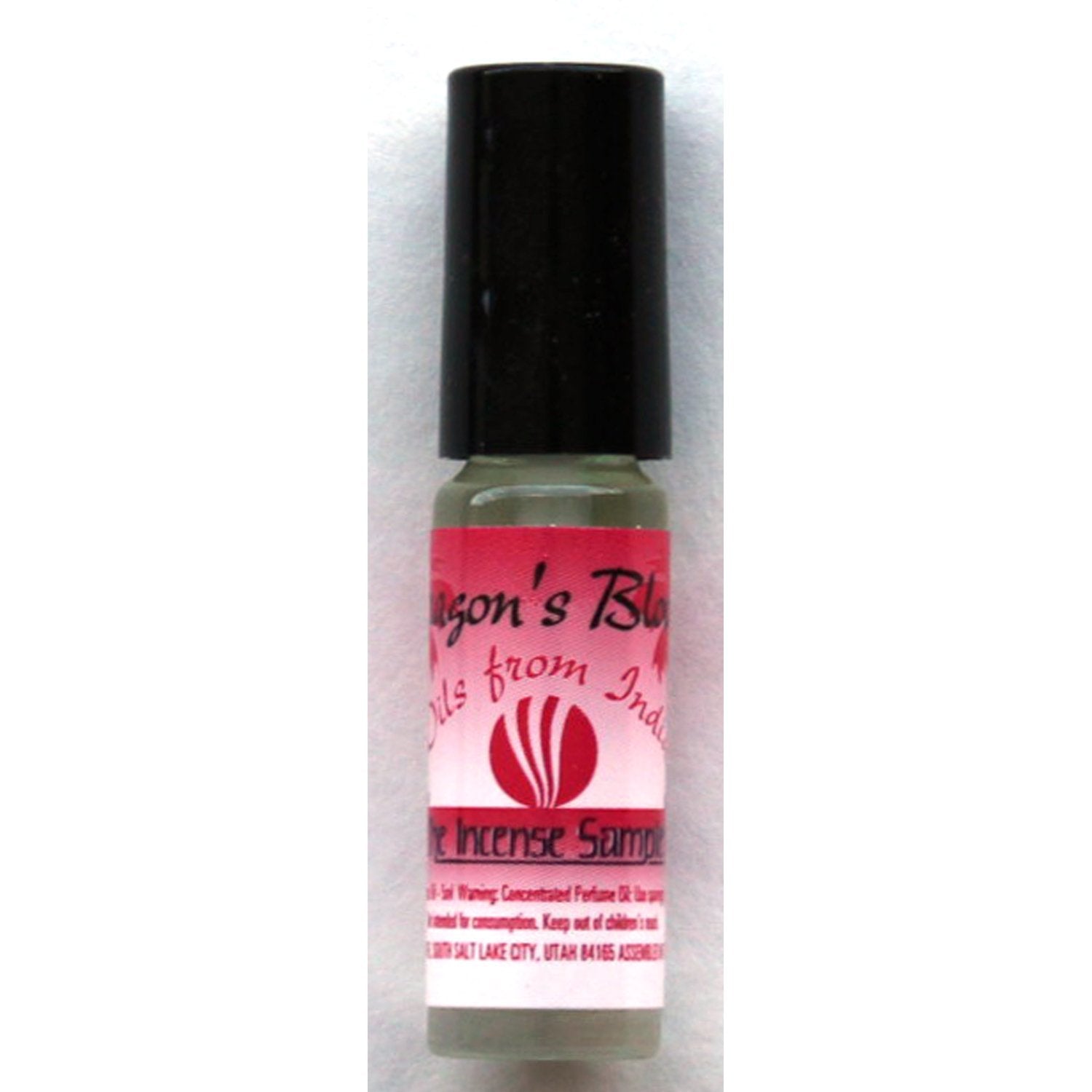Dragon's Blood concentrated perfume oil from The Incense Sampler in glass roll-on applicator with red label, featuring traditional Indian fragrance.
