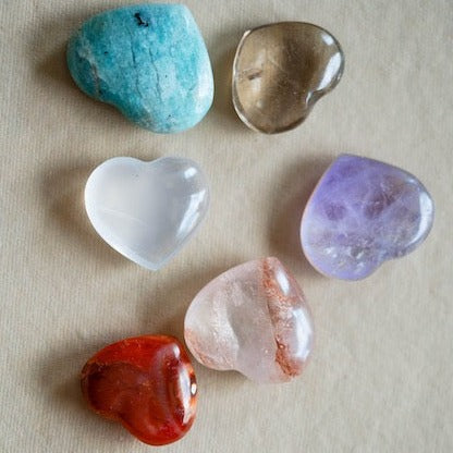 Collection of semiprecious stone hearts approximately 1.5 inches wide including turquoise, clear quartz, white howlite, amethyst, rose quartz and red jasper 